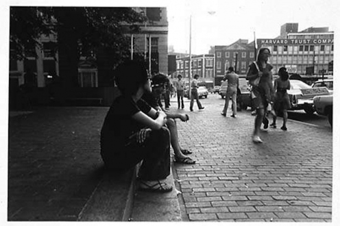 Adrian Piper – The Mythic Being, 1972-1975 - Adrian Piper Cruising White Women #2, 1975. B/W photo documentation of a street performance in Cambridge, MA, 10 x 8 in.