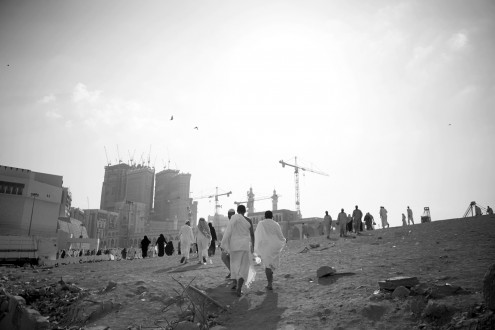 <i>Hajj, Trip of a Liftime</i>. 2008, 70 x 100 cm. "TEXT MSG: "Please forgive me if I wronged you in any way. I'm going to Hajj." When a Muslim has the privilege to go on the holy pilgrimage to Mecca, Saudi Arabia, it is customary for him or her to ask all family members and friends for forgiveness, which I did via text message after I was given a press visa to take pictures there. Soon after that people came around bringing essentials for the trip. My aunt gave me prayer beads, my nephew made me a white dress, which is the customary color during Hajj. There were over a hundred replies: "Please pray for me", "Ask God to help me find a nice wife, a house, restore my health" and many more such requests. Only Muslims are allowed to go to Mecca so westerners are not welcome and therefore their view is limited to what they have seen in the media. But for Muslims the Hajj is the spiritual trip of a lifetime in which they pray and perform rituals. But the pilgrims also shop for souvenirs have their pictures taken with camels and call relatives saying they are at Hajj.