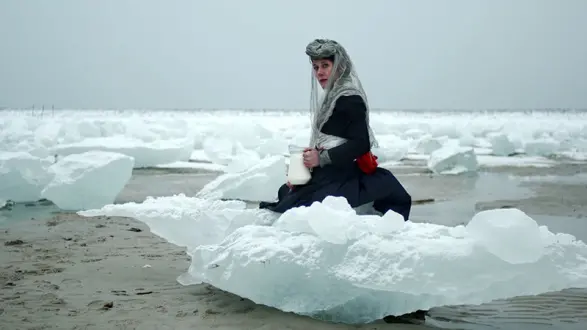 Jessica Segall (American) A Thirsty Person, Having Found a Spring, Stops to Drink, Does Not Contemplate Its Beauty, 2011 Performance / video still, Archival Print, size. Edition 3 and AP ©2011 Jessica Segall. Courtesy of the artist.