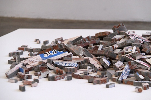 Noor Ali Chagani, Broken Walls, 2009. Terracotta Bricks, cement and wall paints (distemper), variable size.