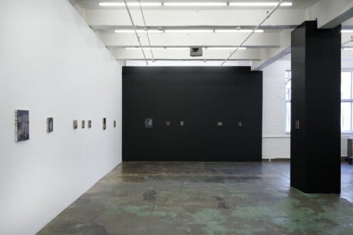 Installation view of west and south walls.