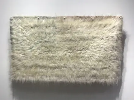 Sonya Kelliher-Combs (Native American, b. 1969) Mark, Polar Bear, 2019 Acrylic polymer, polar bear fur, fabric flag, metal brackets, 40 x 65 in ©2019 Sonya Kelliher-Combs. Courtesy of the artist and Minus Space.