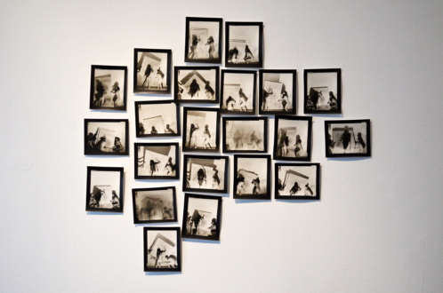 Feminism and the Legacy of Surrealism - Elaine Stocki, <i>Studies for “Nudes Moving an Abstract Painting” </i> 2013. 22 silver gelatin prints.
<br>
<br>
Elaine Stocki’s carefully staged and formally luscious images of nude women carrying abstract paintings revisit the aesthetics of 1970s-era performance documentation, combining that genre’s relationship to the provisional with a thoughtful, even classical approach to photography. The dark shadows cast by the protagonists and the illegibility of their action - its seeming lack of purpose - evokes a sense of ritual secrecy. Relaxing her previously stringent editing process, Stocki’s accumulation of images allows for a greater degree of insight into the performative genesis of these photographs and the enigma at their center.