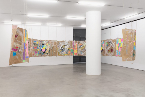 Mike Cloud - <i>Modern Untitled Tragic Timeline</i>, 2019, Collage-acrylic paint, cash,
grocery bags on paper, acrylic tubes and twine, 47 x 720 inches/ ~119 x 1829 cm
(image credit: Pierre Le Hors; courtesy of Marlborough Contemporary)